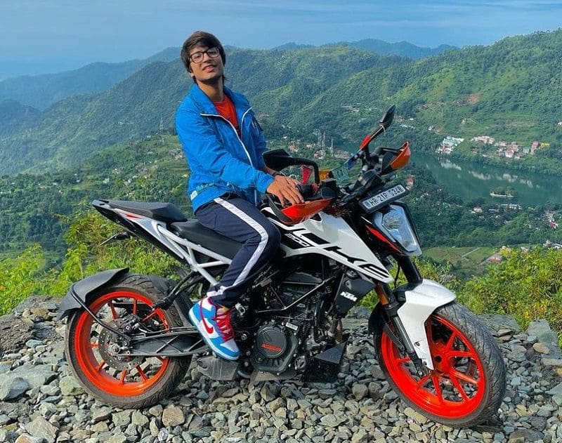 Sourav joshi sitting on KTM bike